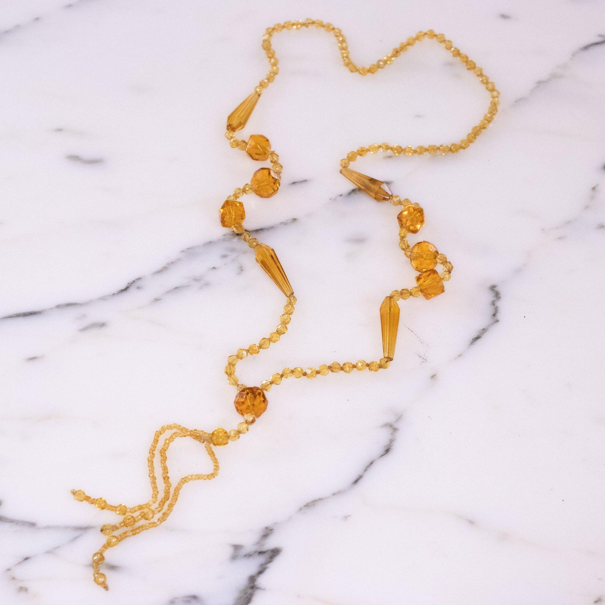 Vintage Art Deco Yellow Faceted Crystal Tassel Necklace by Vintage Meet Modern - Vintage Meet Modern Vintage Jewelry - Chicago, Illinois - #oldhollywoodglamour #vintagemeetmodern #designervintage #jewelrybox #antiquejewelry #vintagejewelry