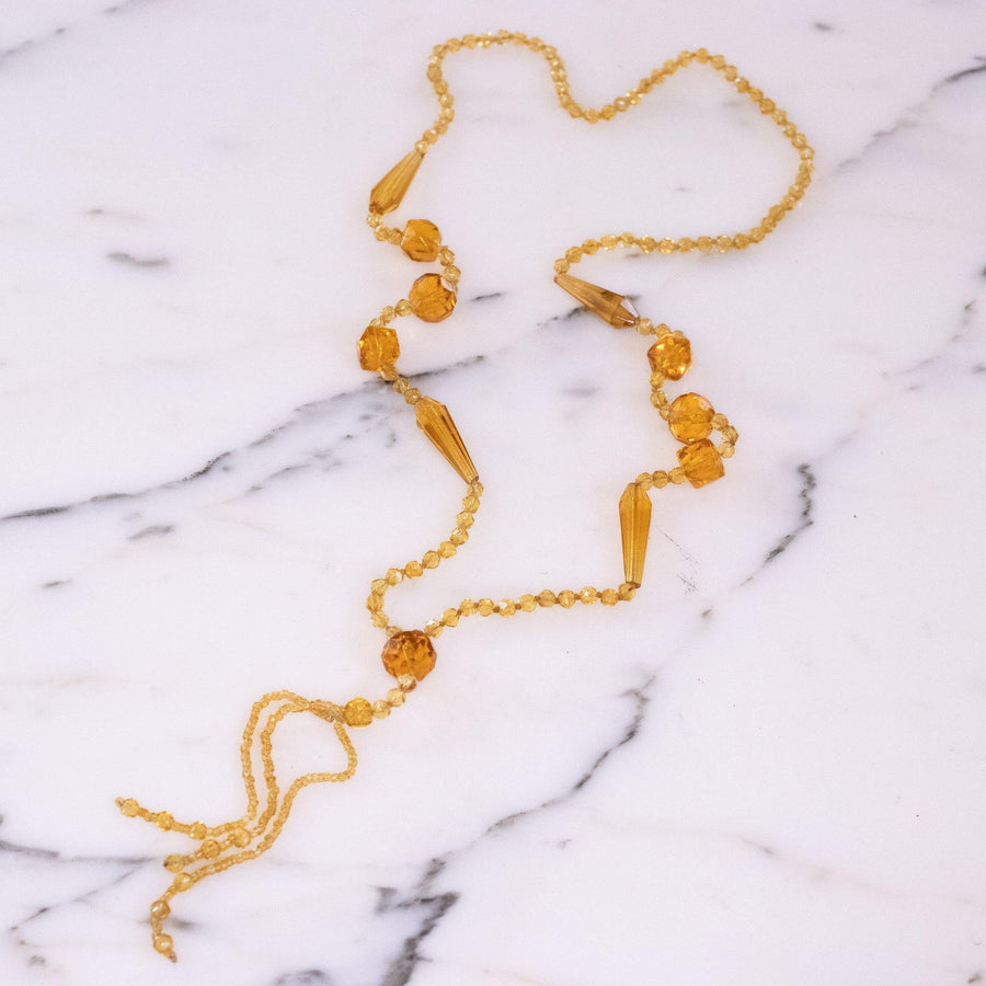 Vintage Art Deco Yellow Faceted Crystal Tassel Necklace by Vintage Meet Modern - Vintage Meet Modern Vintage Jewelry - Chicago, Illinois - #oldhollywoodglamour #vintagemeetmodern #designervintage #jewelrybox #antiquejewelry #vintagejewelry