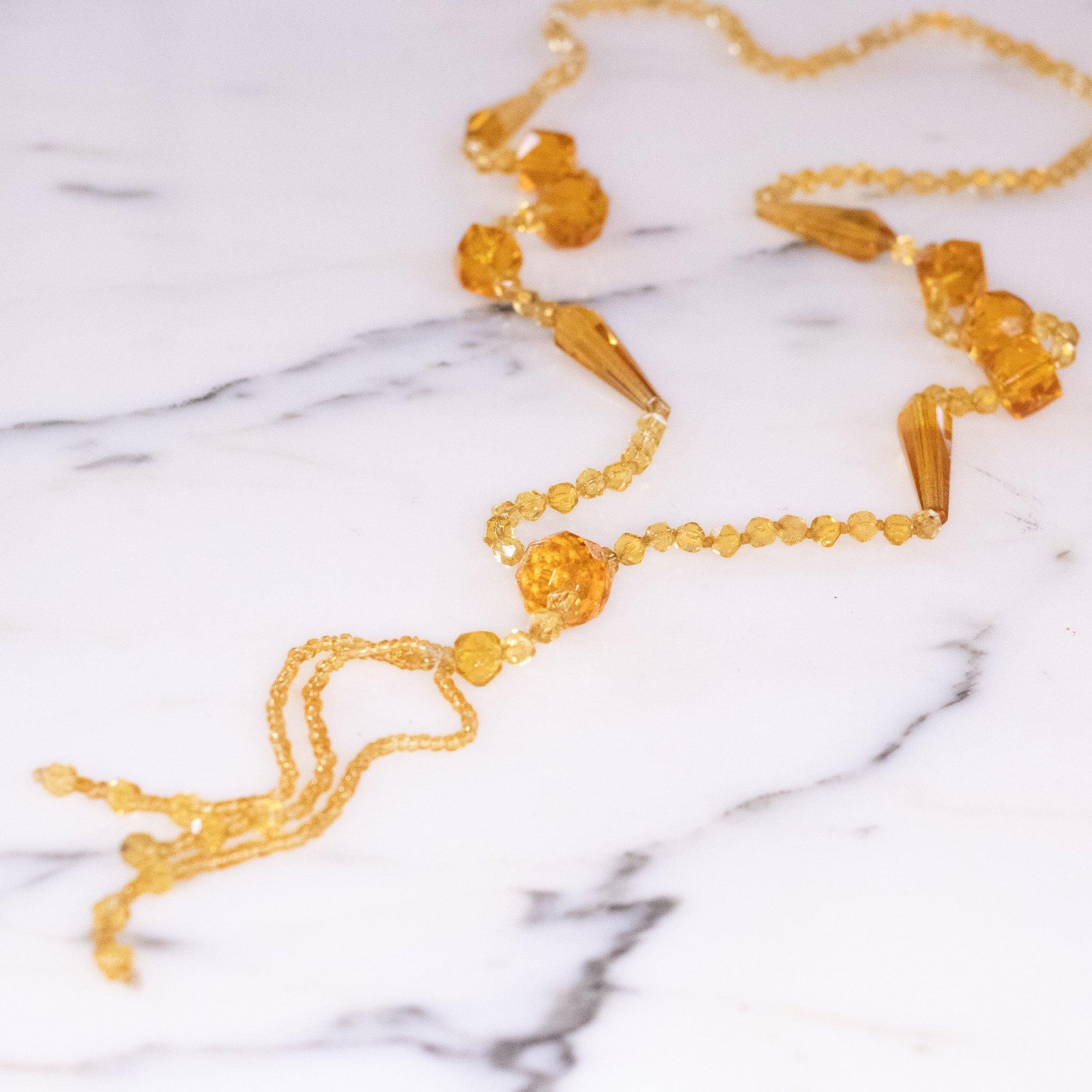 Vintage Art Deco Yellow Faceted Crystal Tassel Necklace by Vintage Meet Modern - Vintage Meet Modern Vintage Jewelry - Chicago, Illinois - #oldhollywoodglamour #vintagemeetmodern #designervintage #jewelrybox #antiquejewelry #vintagejewelry