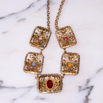 Vintage 1940s Czech Gilt Necklace with Jewel Tone Rhinestones in Red, Blue, Yellow, and Purple by Vintage Meet Modern  - Vintage Meet Modern Vintage Jewelry - Chicago, Illinois - #oldhollywoodglamour #vintagemeetmodern #designervintage #jewelrybox #antiquejewelry #vintagejewelry