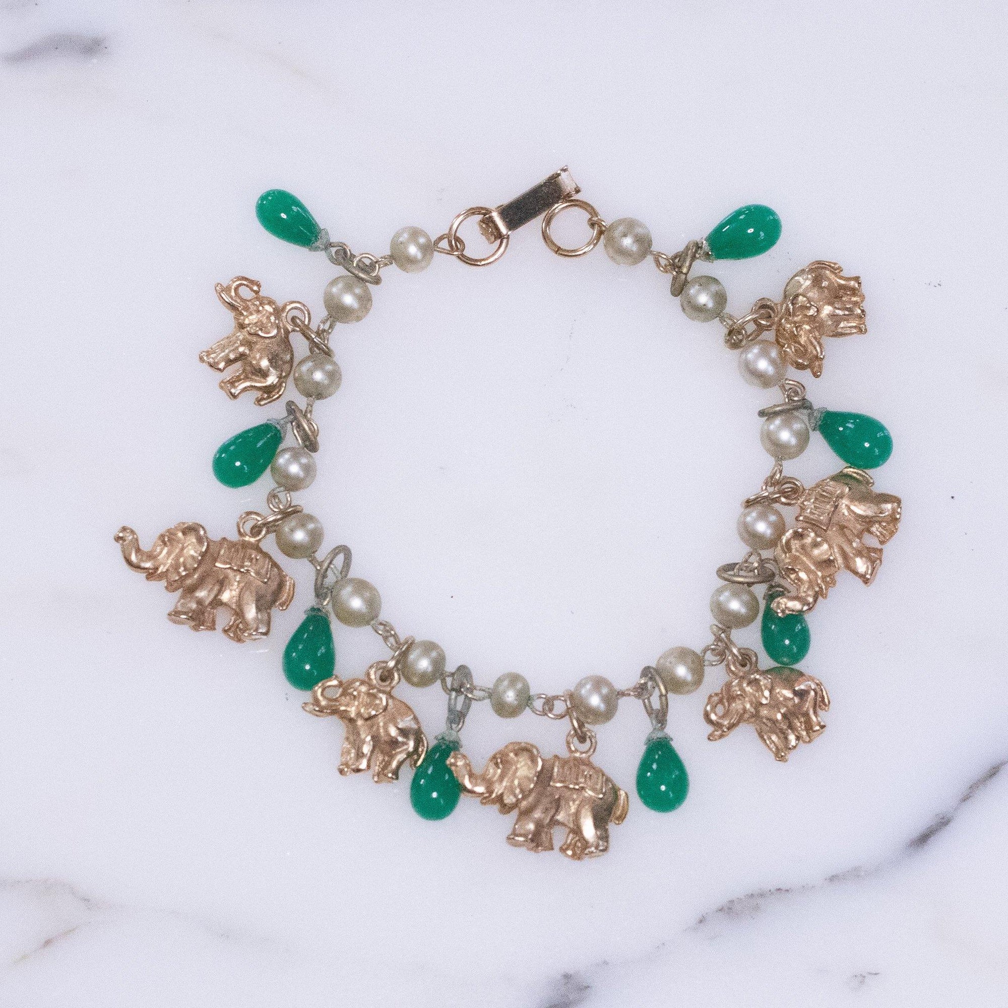 Vintage Faux Pearl with Gold Walking Elephant and Jade Glass Bead Charm Bracelet by Vintage Meet Modern - Vintage Meet Modern Vintage Jewelry - Chicago, Illinois - #oldhollywoodglamour #vintagemeetmodern #designervintage #jewelrybox #antiquejewelry #vintagejewelry