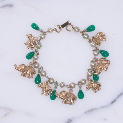 Vintage Faux Pearl with Gold Walking Elephant and Jade Glass Bead Charm Bracelet by Vintage Meet Modern - Vintage Meet Modern Vintage Jewelry - Chicago, Illinois - #oldhollywoodglamour #vintagemeetmodern #designervintage #jewelrybox #antiquejewelry #vintagejewelry