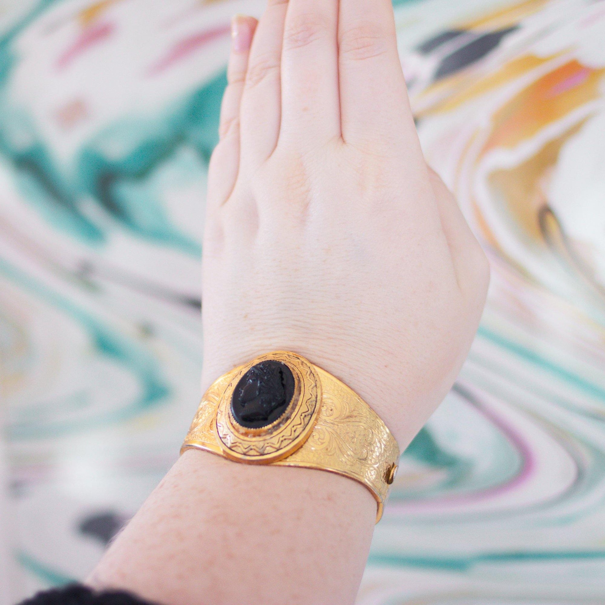 Vintage Czech Gold Tone Embossed Cuff Bracelet with Black Lucite Cameo by Czech - Vintage Meet Modern Vintage Jewelry - Chicago, Illinois - #oldhollywoodglamour #vintagemeetmodern #designervintage #jewelrybox #antiquejewelry #vintagejewelry