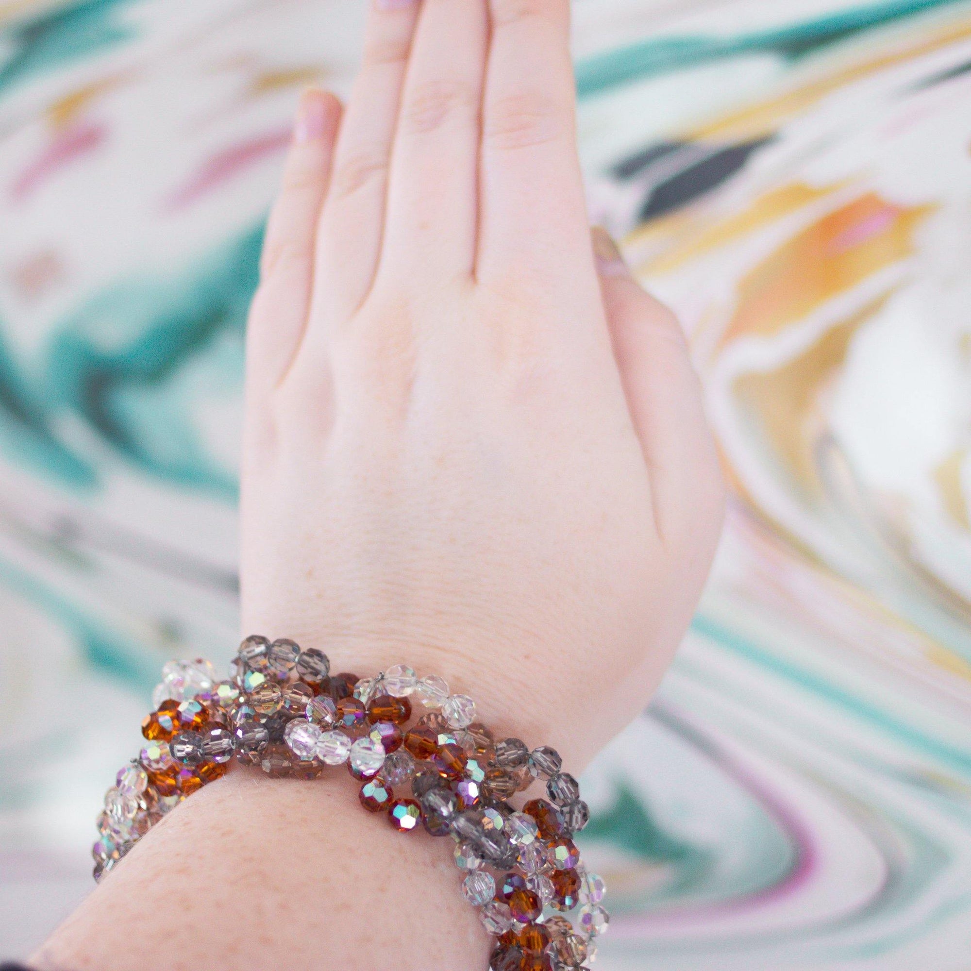 Vintage Vendome Looped Aurora Borealis, Amber, and Smoke Faceted Crystal Bead Bracelet with Rhinestones Clasp by Vintage Meet Modern - Vintage Meet Modern Vintage Jewelry - Chicago, Illinois - #oldhollywoodglamour #vintagemeetmodern #designervintage #jewelrybox #antiquejewelry #vintagejewelry