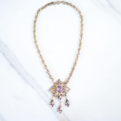 Vintage Coro Purple Crystal Gold Lavalier with Dangling Charms Necklace by Coro - Vintage Meet Modern Vintage Jewelry - Chicago, Illinois - #oldhollywoodglamour #vintagemeetmodern #designervintage #jewelrybox #antiquejewelry #vintagejewelry
