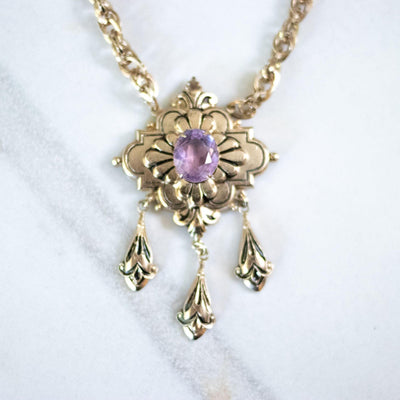 Vintage Coro Purple Crystal Gold Lavalier with Dangling Charms Necklace by Coro - Vintage Meet Modern Vintage Jewelry - Chicago, Illinois - #oldhollywoodglamour #vintagemeetmodern #designervintage #jewelrybox #antiquejewelry #vintagejewelry