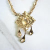Vintage Coro Purple Crystal Gold Lavalier with Dangling Charms Necklace by Coro - Vintage Meet Modern Vintage Jewelry - Chicago, Illinois - #oldhollywoodglamour #vintagemeetmodern #designervintage #jewelrybox #antiquejewelry #vintagejewelry