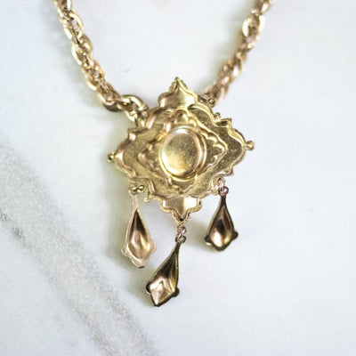 Vintage Coro Purple Crystal Gold Lavalier with Dangling Charms Necklace by Coro - Vintage Meet Modern Vintage Jewelry - Chicago, Illinois - #oldhollywoodglamour #vintagemeetmodern #designervintage #jewelrybox #antiquejewelry #vintagejewelry