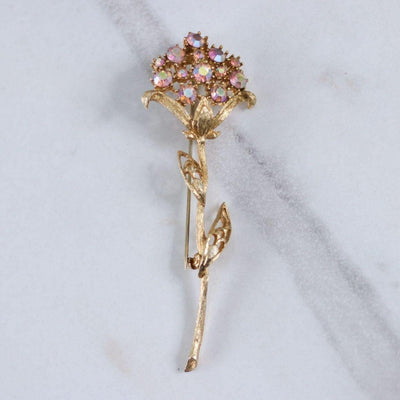 Vintage Gold Long Stem Flower Brooch with Pink Aurora Borealis Rhinestones by Unsigned Beauty - Vintage Meet Modern Vintage Jewelry - Chicago, Illinois - #oldhollywoodglamour #vintagemeetmodern #designervintage #jewelrybox #antiquejewelry #vintagejewelry