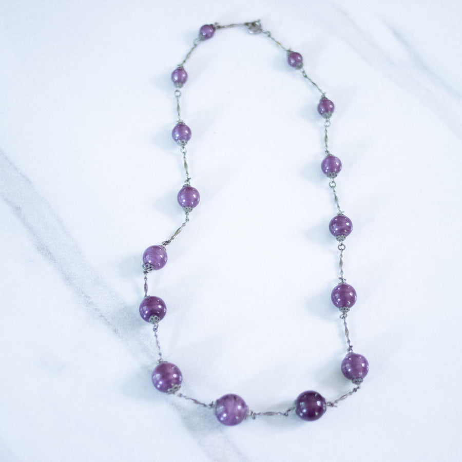 Vintage Art Deco Marbled Purple Bead Flapper Necklace by Czech - Vintage Meet Modern Vintage Jewelry - Chicago, Illinois - #oldhollywoodglamour #vintagemeetmodern #designervintage #jewelrybox #antiquejewelry #vintagejewelry