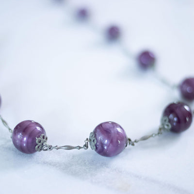 Vintage Art Deco Marbled Purple Bead Flapper Necklace by Czech - Vintage Meet Modern Vintage Jewelry - Chicago, Illinois - #oldhollywoodglamour #vintagemeetmodern #designervintage #jewelrybox #antiquejewelry #vintagejewelry