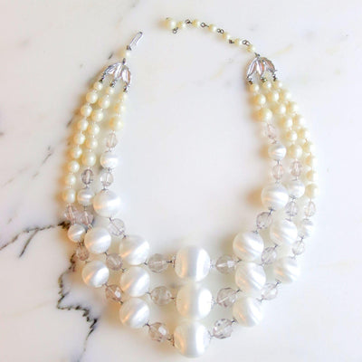 Vintage Pearl White Lucite Triple Strand Necklace by Vintage Meet Modern - Vintage Meet Modern Vintage Jewelry - Chicago, Illinois - #oldhollywoodglamour #vintagemeetmodern #designervintage #jewelrybox #antiquejewelry #vintagejewelry