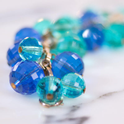 Vintage Faceted Blue and Green Faceted Lucite and Gold Rhinestone Charm Bracelet by Unsigned Beauty - Vintage Meet Modern Vintage Jewelry - Chicago, Illinois - #oldhollywoodglamour #vintagemeetmodern #designervintage #jewelrybox #antiquejewelry #vintagejewelry
