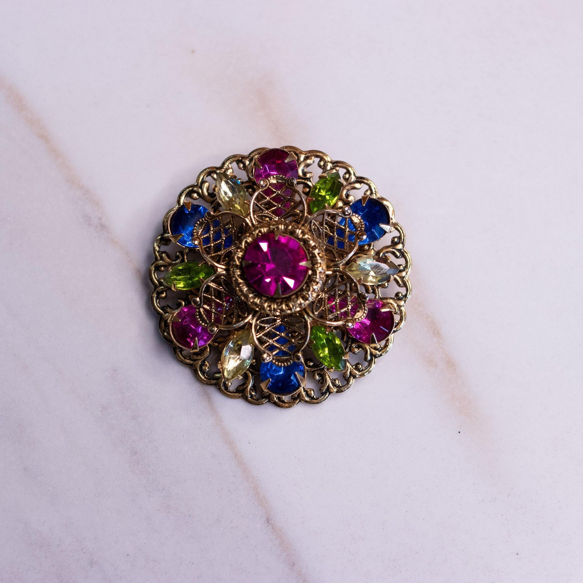 Vintage Medallion Brooch with Pink, Blue, and Green Rhinestones by Unsigned Beauty - Vintage Meet Modern Vintage Jewelry - Chicago, Illinois - #oldhollywoodglamour #vintagemeetmodern #designervintage #jewelrybox #antiquejewelry #vintagejewelry