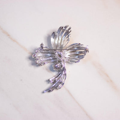 Vintage Mid Century Modern Silver Swirl Brooch with Light Blue Rhinestone by Emmons - Vintage Meet Modern Vintage Jewelry - Chicago, Illinois - #oldhollywoodglamour #vintagemeetmodern #designervintage #jewelrybox #antiquejewelry #vintagejewelry
