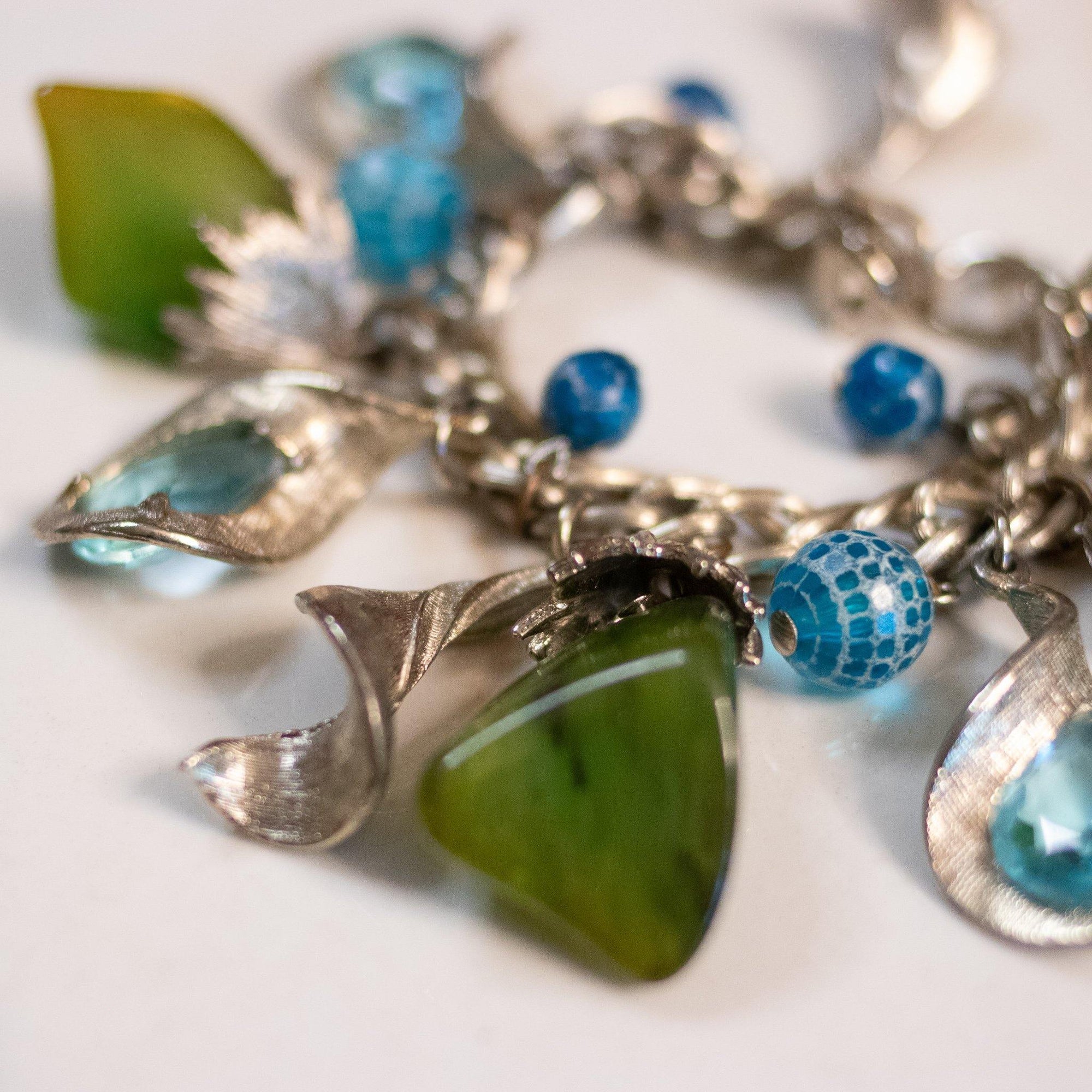 Vintage 1950s Mid Century Modern Blue and Green Lucite Charm Bracelet by Unsigned Beauty - Vintage Meet Modern Vintage Jewelry - Chicago, Illinois - #oldhollywoodglamour #vintagemeetmodern #designervintage #jewelrybox #antiquejewelry #vintagejewelry