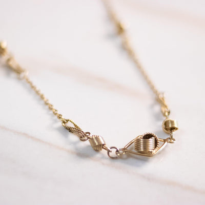 Vintage 1970s Minimalist Gold Knot Necklace by Unsigned Beauty - Vintage Meet Modern Vintage Jewelry - Chicago, Illinois - #oldhollywoodglamour #vintagemeetmodern #designervintage #jewelrybox #antiquejewelry #vintagejewelry