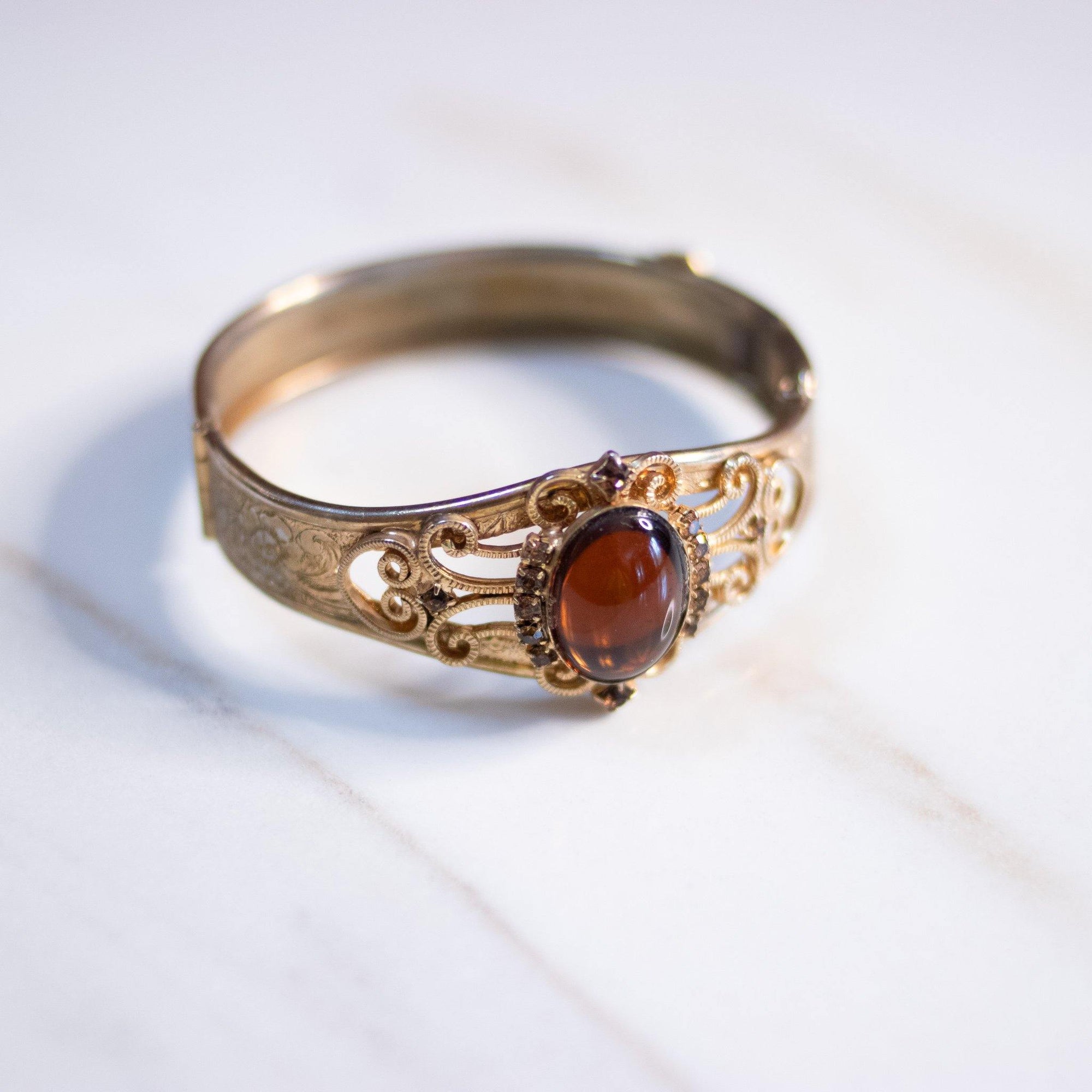 Vintage Czech Gold Embossed Bangle Bracelet with Amber Glass Cabochon by Czech - Vintage Meet Modern Vintage Jewelry - Chicago, Illinois - #oldhollywoodglamour #vintagemeetmodern #designervintage #jewelrybox #antiquejewelry #vintagejewelry