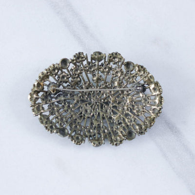 Vintage Large Green Brass Pot Metal Brooch with Embossed Floral Design and Green Rhinestone Accents by Unsigned Beauty - Vintage Meet Modern Vintage Jewelry - Chicago, Illinois - #oldhollywoodglamour #vintagemeetmodern #designervintage #jewelrybox #antiquejewelry #vintagejewelry