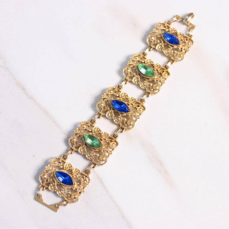 Vintage Ornate Wide Gold Panel Bracelet with Blue and Green Rhinestones by Unsigned Beauty - Vintage Meet Modern Vintage Jewelry - Chicago, Illinois - #oldhollywoodglamour #vintagemeetmodern #designervintage #jewelrybox #antiquejewelry #vintagejewelry