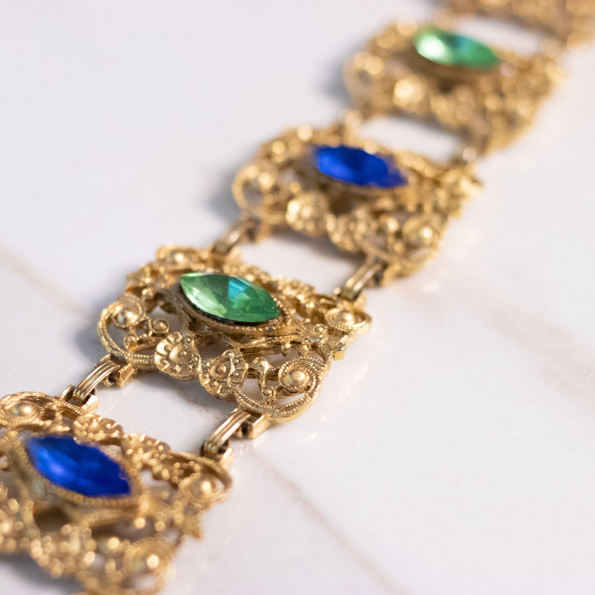 Vintage Ornate Wide Gold Panel Bracelet with Blue and Green Rhinestones by Unsigned Beauty - Vintage Meet Modern Vintage Jewelry - Chicago, Illinois - #oldhollywoodglamour #vintagemeetmodern #designervintage #jewelrybox #antiquejewelry #vintagejewelry