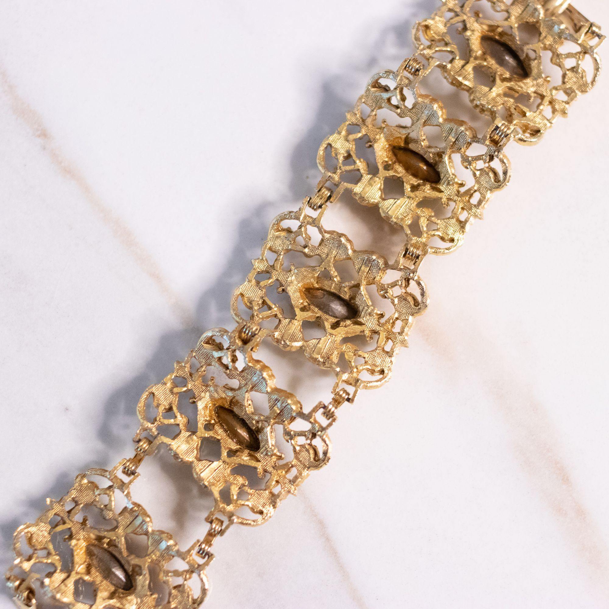 Vintage Ornate Wide Gold Panel Bracelet with Blue and Green Rhinestones by Unsigned Beauty - Vintage Meet Modern Vintage Jewelry - Chicago, Illinois - #oldhollywoodglamour #vintagemeetmodern #designervintage #jewelrybox #antiquejewelry #vintagejewelry