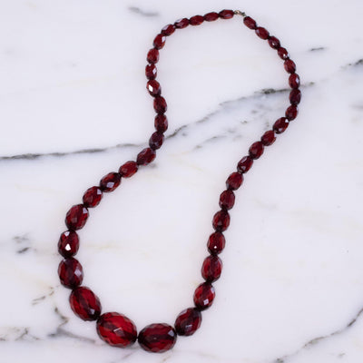 Vintage Cherry Juice Amber Bakelite Bead Necklace by Unsigned - Vintage Meet Modern Vintage Jewelry - Chicago, Illinois - #oldhollywoodglamour #vintagemeetmodern #designervintage #jewelrybox #antiquejewelry #vintagejewelry