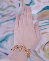 Vintage Trifari Wide Gold Cut Out Link Bracelet by Crown Trifari - Vintage Meet Modern Vintage Jewelry - Chicago, Illinois - #oldhollywoodglamour #vintagemeetmodern #designervintage #jewelrybox #antiquejewelry #vintagejewelry