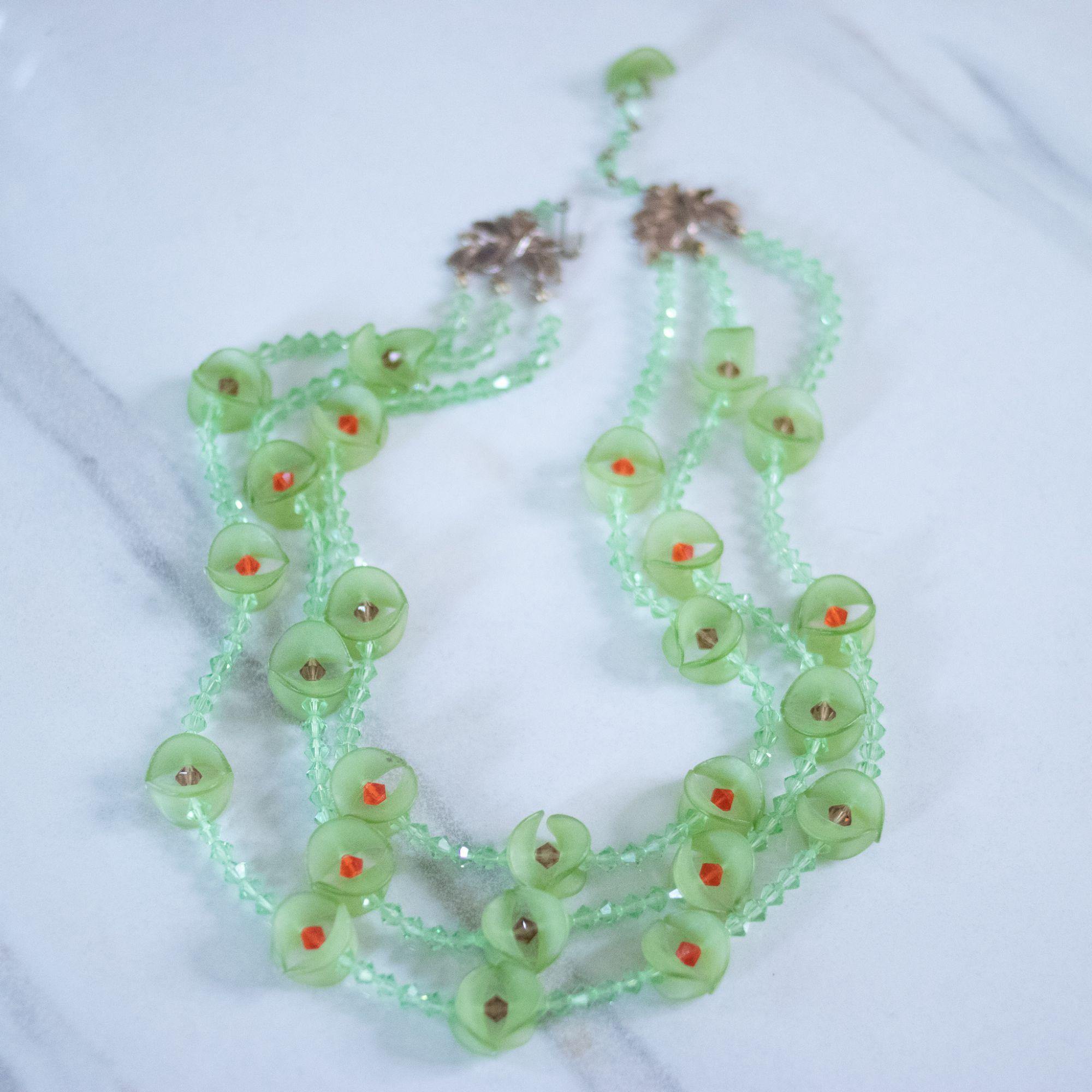 Vintage Green Fluted Lucite and Green, Red Crystal Beaded Triple Strand Necklace by Unsigned Beauty - Vintage Meet Modern Vintage Jewelry - Chicago, Illinois - #oldhollywoodglamour #vintagemeetmodern #designervintage #jewelrybox #antiquejewelry #vintagejewelry