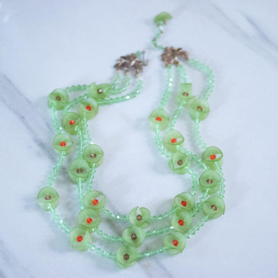 Vintage Green Fluted Lucite and Green, Red Crystal Beaded Triple Strand Necklace by Unsigned Beauty - Vintage Meet Modern Vintage Jewelry - Chicago, Illinois - #oldhollywoodglamour #vintagemeetmodern #designervintage #jewelrybox #antiquejewelry #vintagejewelry