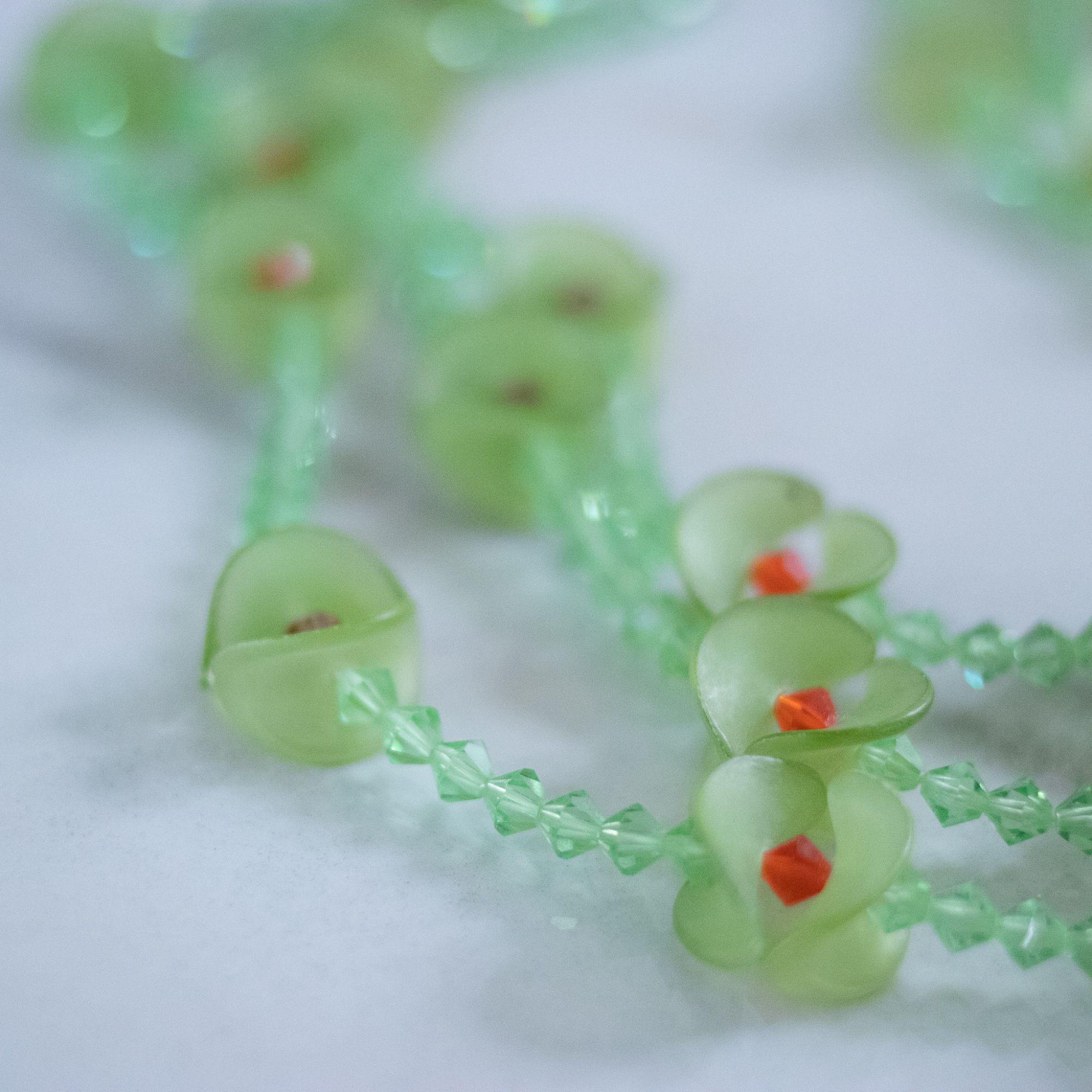 Vintage Green Fluted Lucite and Green, Red Crystal Beaded Triple Strand Necklace by Unsigned Beauty - Vintage Meet Modern Vintage Jewelry - Chicago, Illinois - #oldhollywoodglamour #vintagemeetmodern #designervintage #jewelrybox #antiquejewelry #vintagejewelry