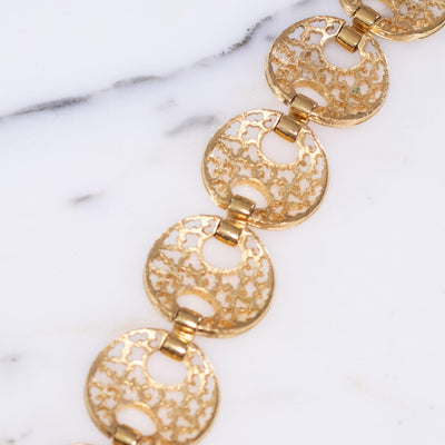 Vintage Trifari Wide Gold Cut Out Link Bracelet by Crown Trifari - Vintage Meet Modern Vintage Jewelry - Chicago, Illinois - #oldhollywoodglamour #vintagemeetmodern #designervintage #jewelrybox #antiquejewelry #vintagejewelry