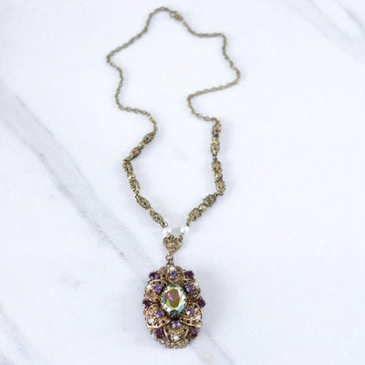 Vintage West Germany Filigree Pendant Necklace with Purple Amethyst Rhinestones and Dark Aurora Borealis Rhinestones by West Germany - Vintage Meet Modern Vintage Jewelry - Chicago, Illinois - #oldhollywoodglamour #vintagemeetmodern #designervintage #jewelrybox #antiquejewelry #vintagejewelry