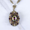 Vintage West Germany Filigree Pendant Necklace with Purple Amethyst Rhinestones and Dark Aurora Borealis Rhinestones by West Germany - Vintage Meet Modern Vintage Jewelry - Chicago, Illinois - #oldhollywoodglamour #vintagemeetmodern #designervintage #jewelrybox #antiquejewelry #vintagejewelry