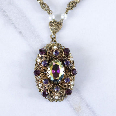 Vintage West Germany Filigree Pendant Necklace with Purple Amethyst Rhinestones and Dark Aurora Borealis Rhinestones by West Germany - Vintage Meet Modern Vintage Jewelry - Chicago, Illinois - #oldhollywoodglamour #vintagemeetmodern #designervintage #jewelrybox #antiquejewelry #vintagejewelry