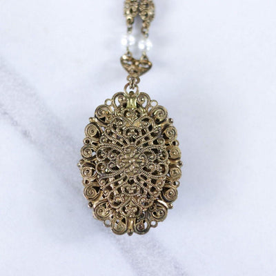 Vintage West Germany Filigree Pendant Necklace with Purple Amethyst Rhinestones and Dark Aurora Borealis Rhinestones by West Germany - Vintage Meet Modern Vintage Jewelry - Chicago, Illinois - #oldhollywoodglamour #vintagemeetmodern #designervintage #jewelrybox #antiquejewelry #vintagejewelry
