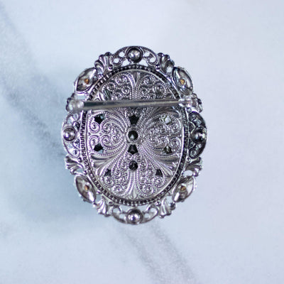 Vintage West Germany Silver Filigree Brooch with Emerald Green Rhinestones, Colorful Crystals, and Faux Pearls by West Germany - Vintage Meet Modern Vintage Jewelry - Chicago, Illinois - #oldhollywoodglamour #vintagemeetmodern #designervintage #jewelrybox #antiquejewelry #vintagejewelry