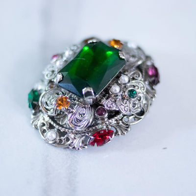 Vintage West Germany Silver Filigree Brooch with Emerald Green Rhinestones, Colorful Crystals, and Faux Pearls by West Germany - Vintage Meet Modern Vintage Jewelry - Chicago, Illinois - #oldhollywoodglamour #vintagemeetmodern #designervintage #jewelrybox #antiquejewelry #vintagejewelry