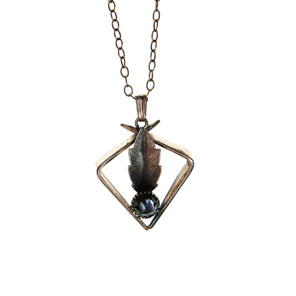 Minimalist and Mod Hematite and Feather Pendant Necklace by Unsigned Beauty - Vintage Meet Modern Vintage Jewelry - Chicago, Illinois - #oldhollywoodglamour #vintagemeetmodern #designervintage #jewelrybox #antiquejewelry #vintagejewelry