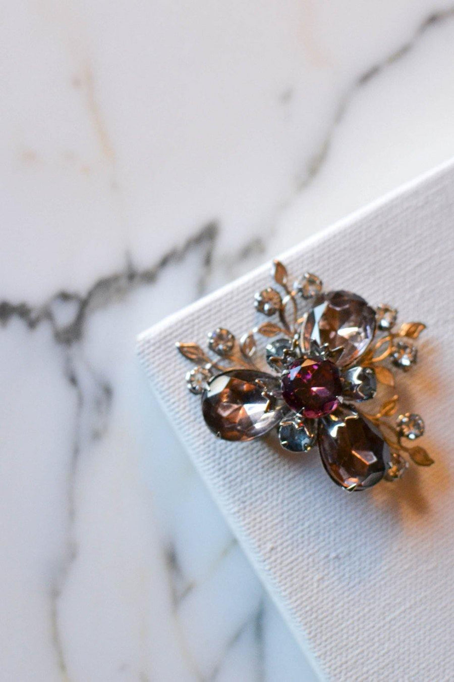 Purple and Smokey Gray Rhinestone Flower Brooch by Unsigned Beauty - Vintage Meet Modern Vintage Jewelry - Chicago, Illinois - #oldhollywoodglamour #vintagemeetmodern #designervintage #jewelrybox #antiquejewelry #vintagejewelry