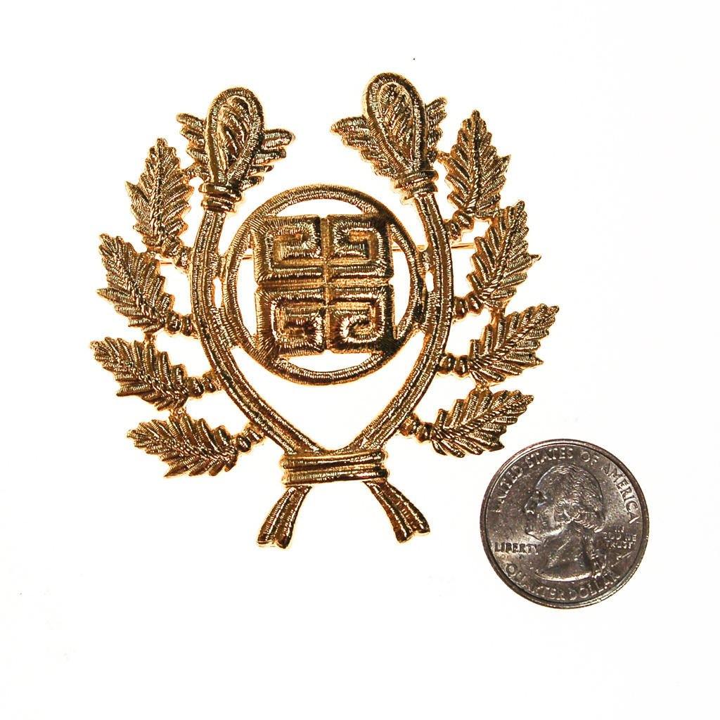 Givenchy Gold Logo Brooch by Givenchy - Vintage Meet Modern Vintage Jewelry - Chicago, Illinois - #oldhollywoodglamour #vintagemeetmodern #designervintage #jewelrybox #antiquejewelry #vintagejewelry