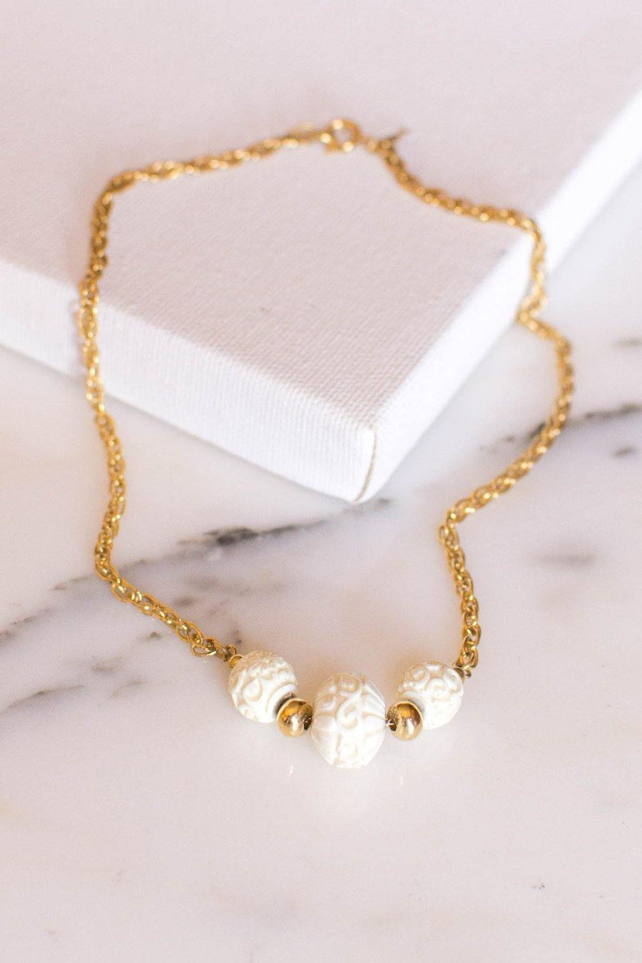 Crown Trifari Carved Three Bead Choker Necklace by Crown Trifari - Vintage Meet Modern Vintage Jewelry - Chicago, Illinois - #oldhollywoodglamour #vintagemeetmodern #designervintage #jewelrybox #antiquejewelry #vintagejewelry