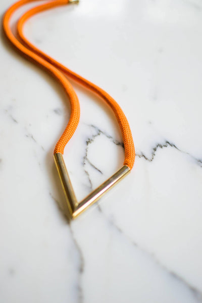 Diane von Furstenberg Orange Silk Cord Gold Triangle Necklace by Diane von Furstenberg - Vintage Meet Modern Vintage Jewelry - Chicago, Illinois - #oldhollywoodglamour #vintagemeetmodern #designervintage #jewelrybox #antiquejewelry #vintagejewelry
