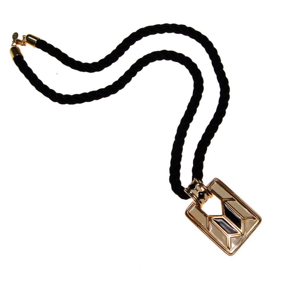Diane von Furstenberg Cream and Black Pendant Necklace, Statement Necklace, Long Black Cord by Diane Von Furstenberg - Vintage Meet Modern Vintage Jewelry - Chicago, Illinois - #oldhollywoodglamour #vintagemeetmodern #designervintage #jewelrybox #antiquejewelry #vintagejewelry