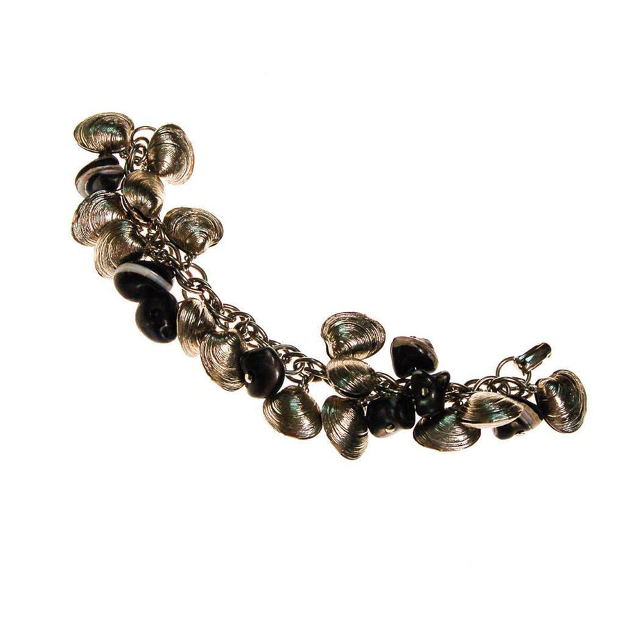 Silver Shell and Black Bead Loaded Charm Bracelet by 1960s - Vintage Meet Modern Vintage Jewelry - Chicago, Illinois - #oldhollywoodglamour #vintagemeetmodern #designervintage #jewelrybox #antiquejewelry #vintagejewelry