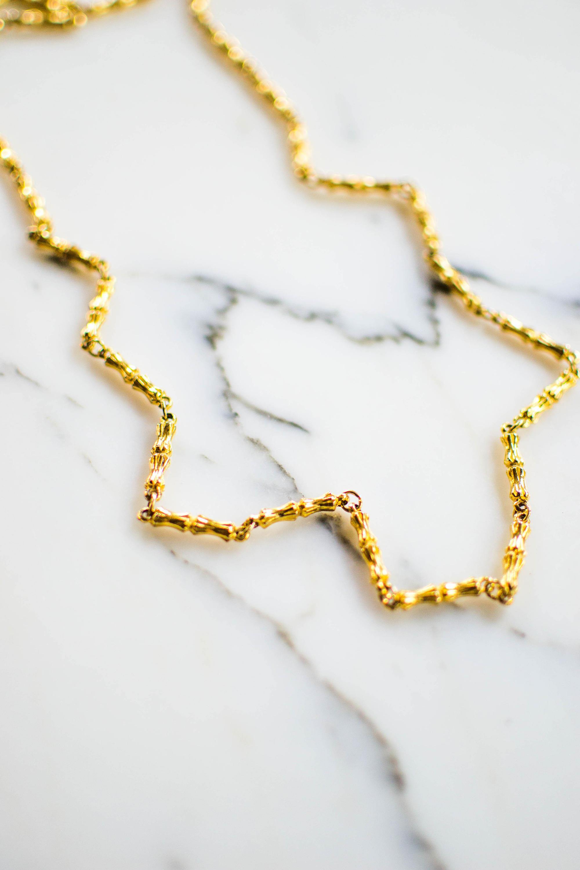 Vintage Diane von Furstenberg Gold Bamboo Link Necklace by Diane von Furstenberg - Vintage Meet Modern Vintage Jewelry - Chicago, Illinois - #oldhollywoodglamour #vintagemeetmodern #designervintage #jewelrybox #antiquejewelry #vintagejewelry