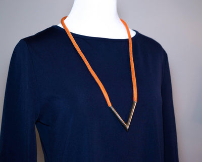 Diane von Furstenberg Orange Silk Cord Gold Triangle Necklace by Diane von Furstenberg - Vintage Meet Modern Vintage Jewelry - Chicago, Illinois - #oldhollywoodglamour #vintagemeetmodern #designervintage #jewelrybox #antiquejewelry #vintagejewelry