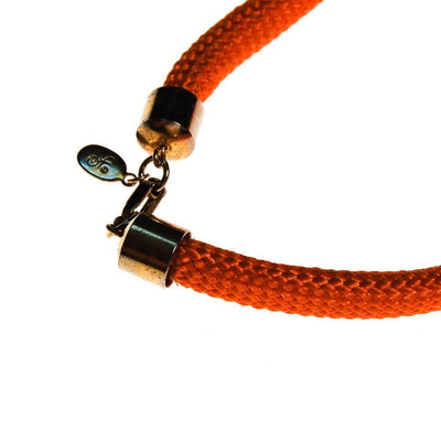 Diane von Furstenberg Orange Silk Cord Gold Triangle Necklace by Diane von Furstenberg - Vintage Meet Modern Vintage Jewelry - Chicago, Illinois - #oldhollywoodglamour #vintagemeetmodern #designervintage #jewelrybox #antiquejewelry #vintagejewelry