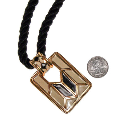 Diane von Furstenberg Cream and Black Pendant Necklace, Statement Necklace, Long Black Cord by Diane Von Furstenberg - Vintage Meet Modern Vintage Jewelry - Chicago, Illinois - #oldhollywoodglamour #vintagemeetmodern #designervintage #jewelrybox #antiquejewelry #vintagejewelry