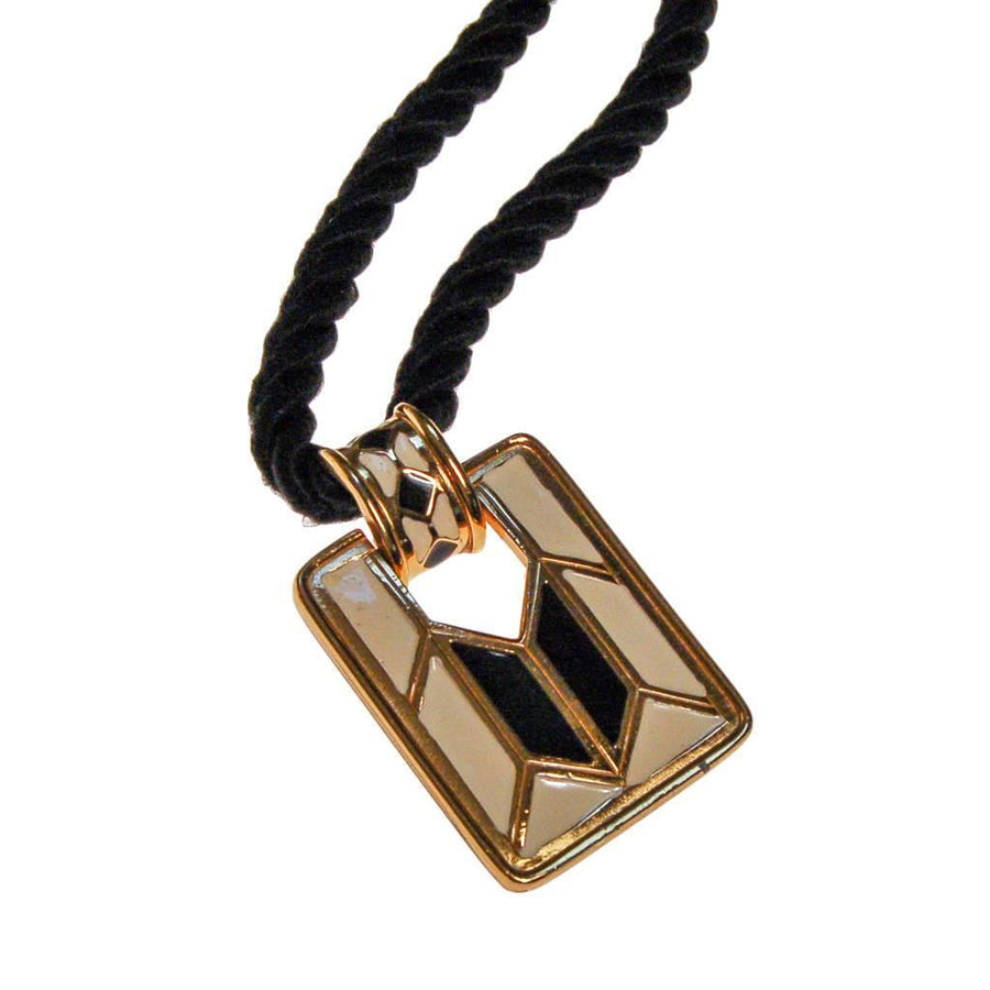 Diane von Furstenberg Cream and Black Pendant Necklace, Statement Necklace, Long Black Cord by Diane Von Furstenberg - Vintage Meet Modern Vintage Jewelry - Chicago, Illinois - #oldhollywoodglamour #vintagemeetmodern #designervintage #jewelrybox #antiquejewelry #vintagejewelry